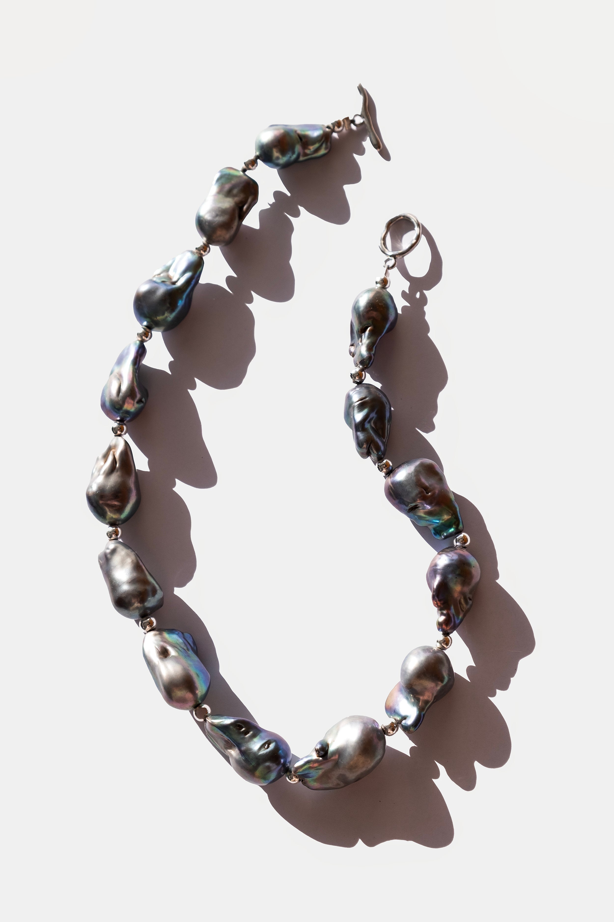 Necklace with large pearls on a white background