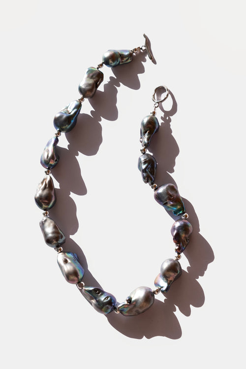 Necklace with large pearls on a white background